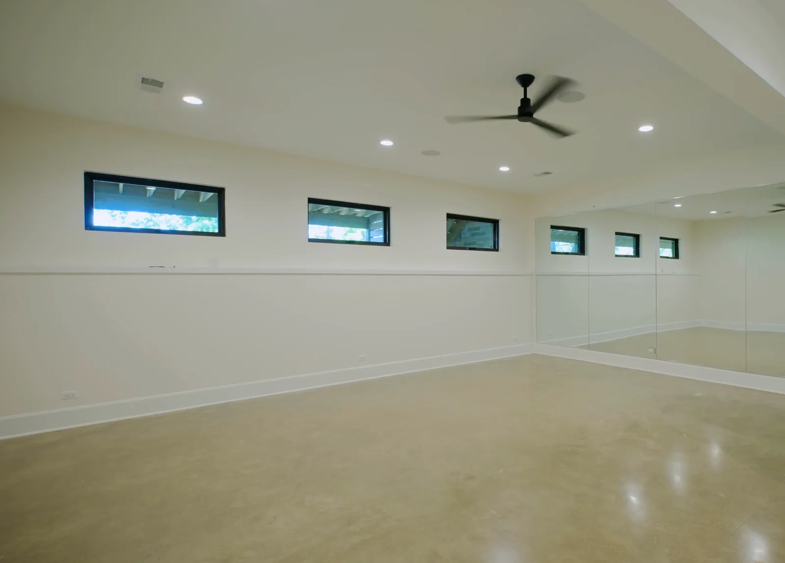 Finished basement with a polished concrete floor