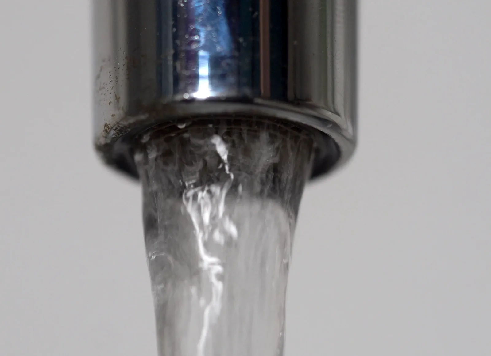 Water running from a kitchen faucet